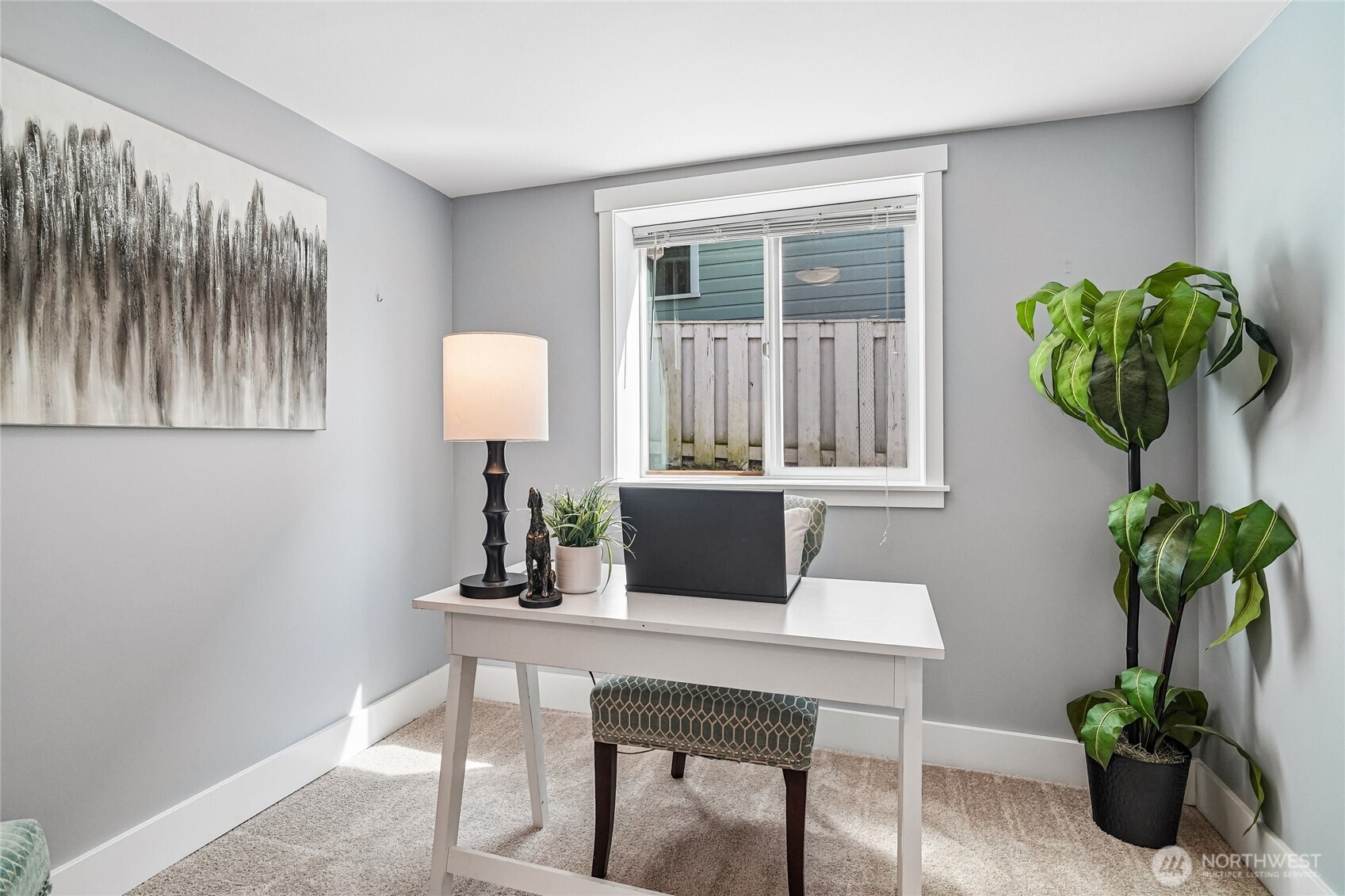 7313 25th Avenue Northwest Seattle, WA 98117 - Photo 27 of 40 a workspace with furniture and a potted plant