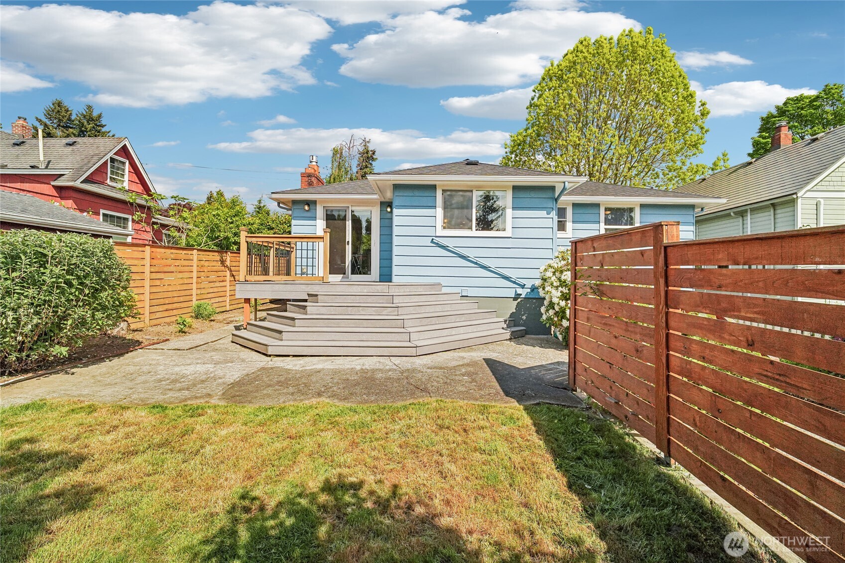 7313 25th Avenue Northwest Seattle, WA 98117 - Photo 29 of 40 a view of a house with a backyard