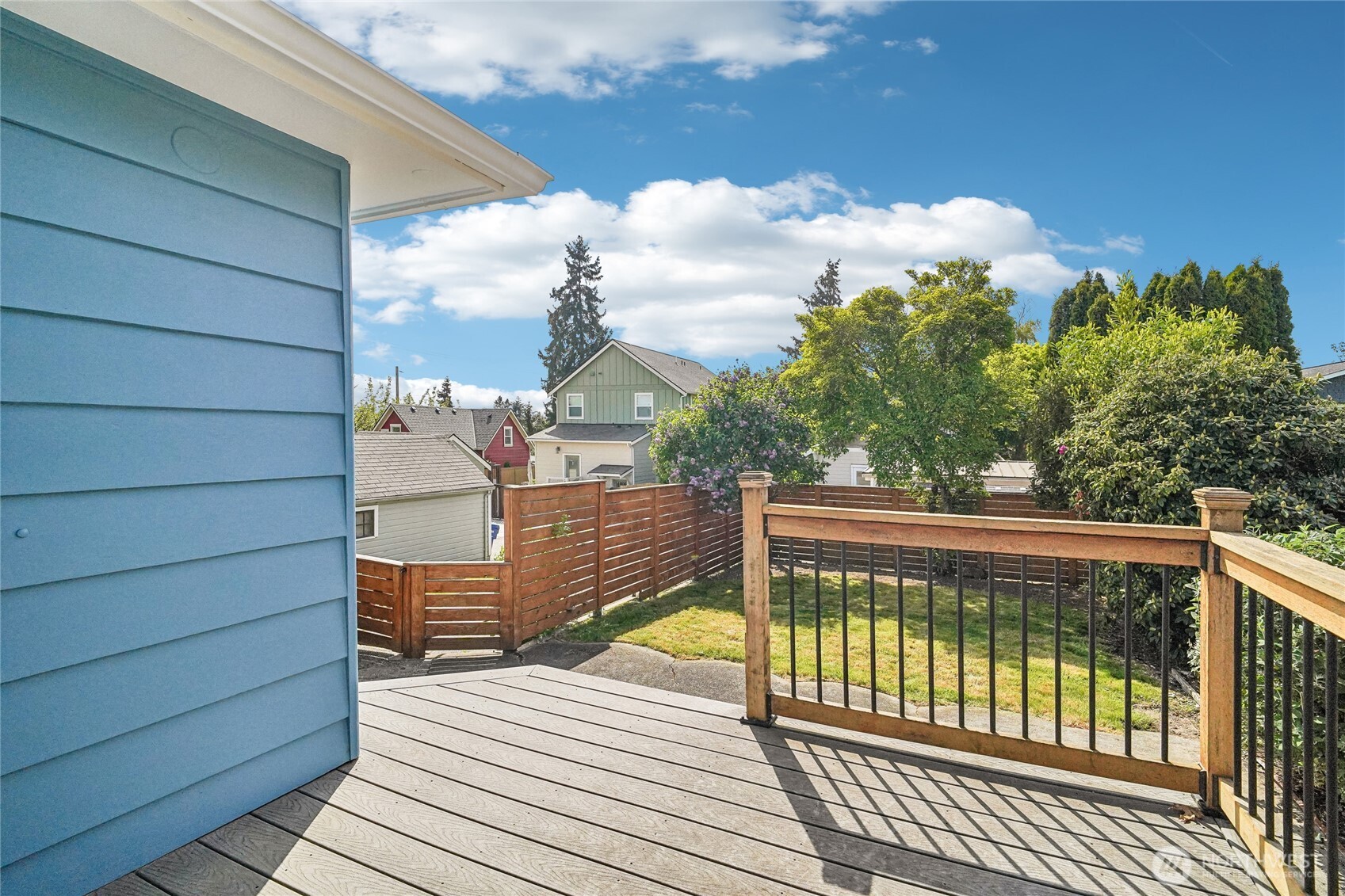7313 25th Avenue Northwest Seattle, WA 98117 - Photo 30 of 40 a view of a balcony with wooden floor