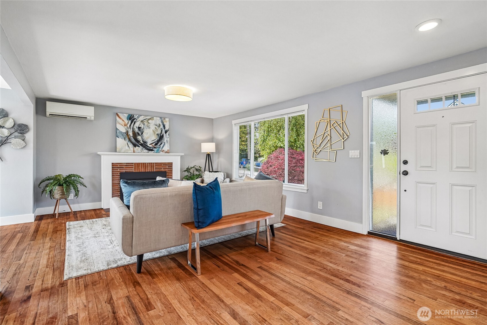 7313 25th Avenue Northwest Seattle, WA 98117 - Photo 3 of 40 a living room with furniture and a wooden floor