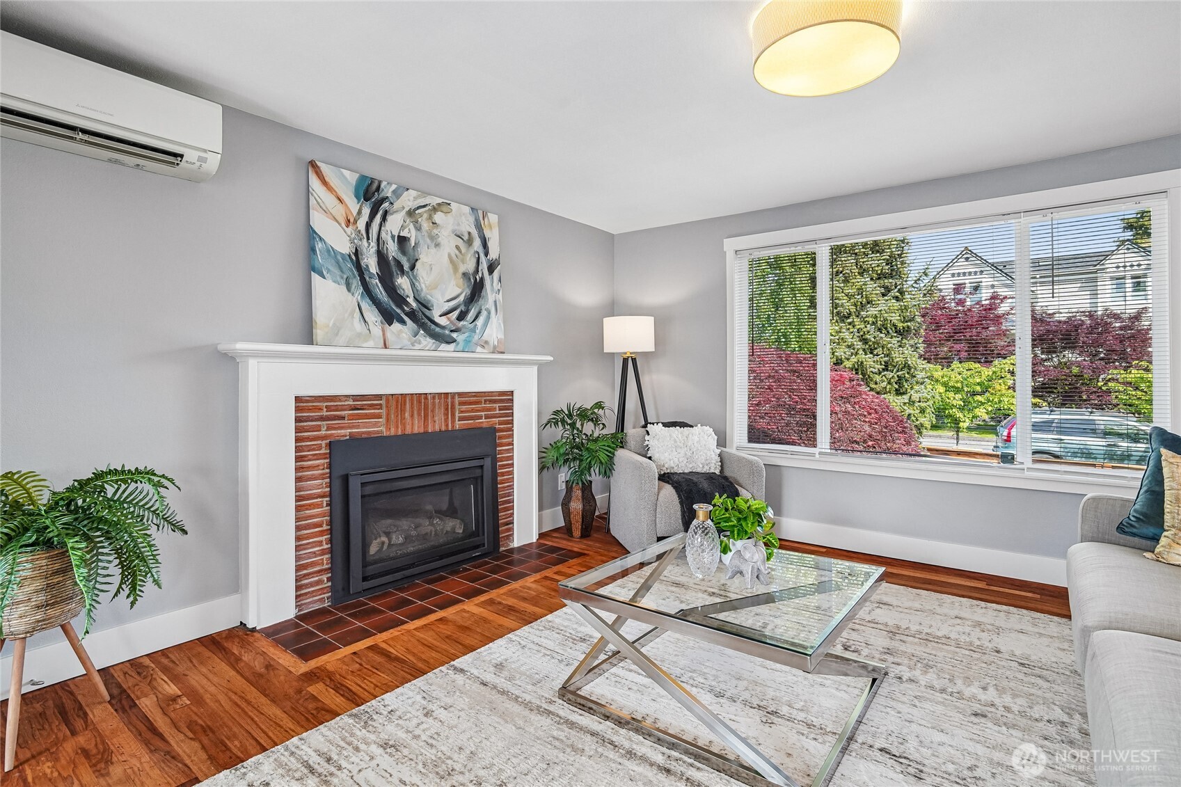 7313 25th Avenue Northwest Seattle, WA 98117 - Photo 4 of 40 a living room with furniture and a fireplace