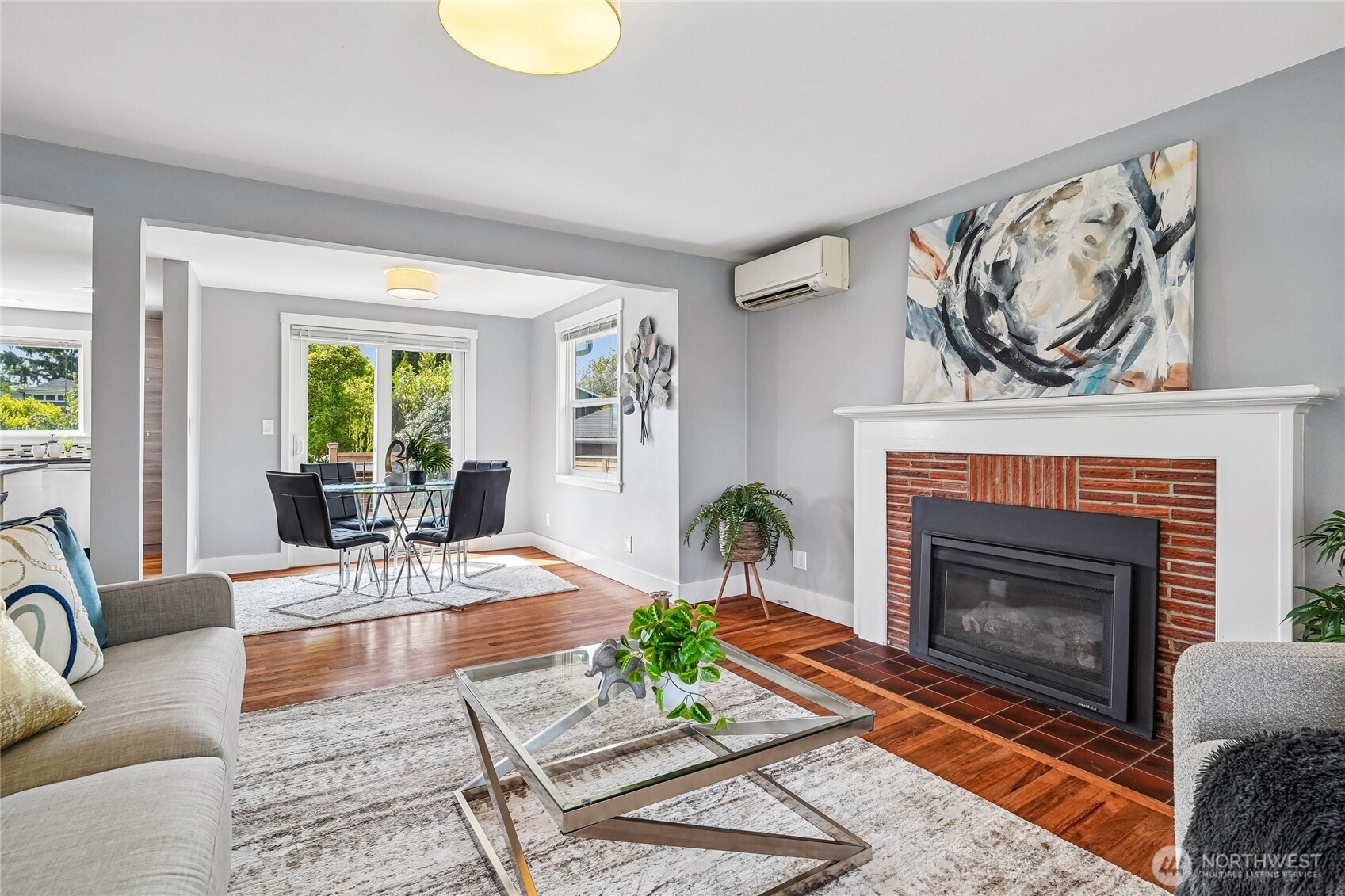 7313 25th Avenue Northwest Seattle, WA 98117 - Photo 5 of 40 a living room with furniture and a fireplace
