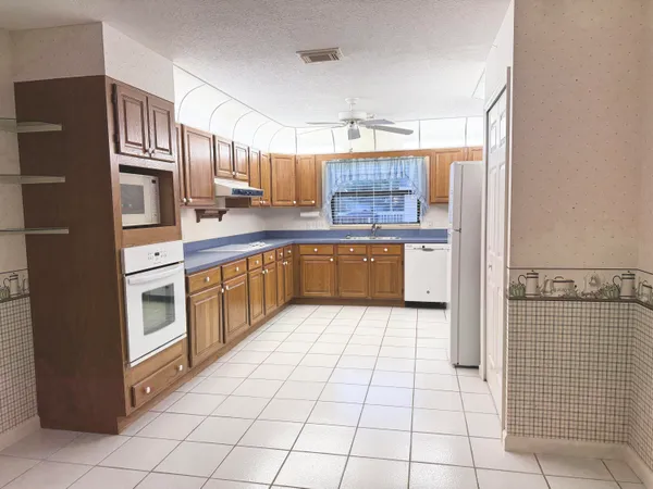 a kitchen with stainless steel appliances a sink and counter space