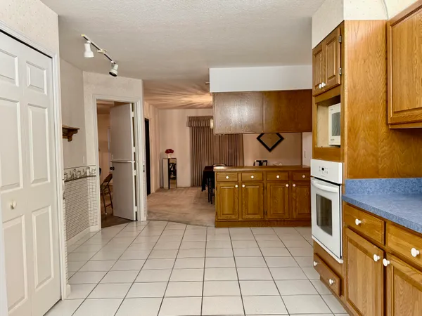 a large bathroom with a sink a vanity and a mirror