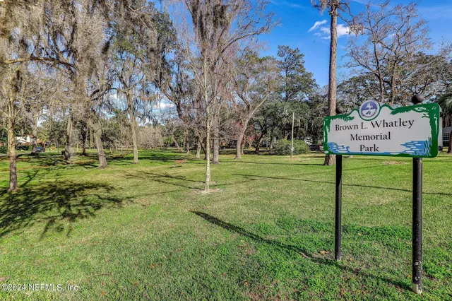 a view of a park with welcome board