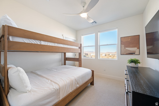 762 West Periwinkle Lane, Unit 102 St. George, UT 84790 - Photo 22 of 40 Bedroom with light carpet and a ceiling fan
