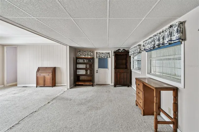 a view of an empty room and a window