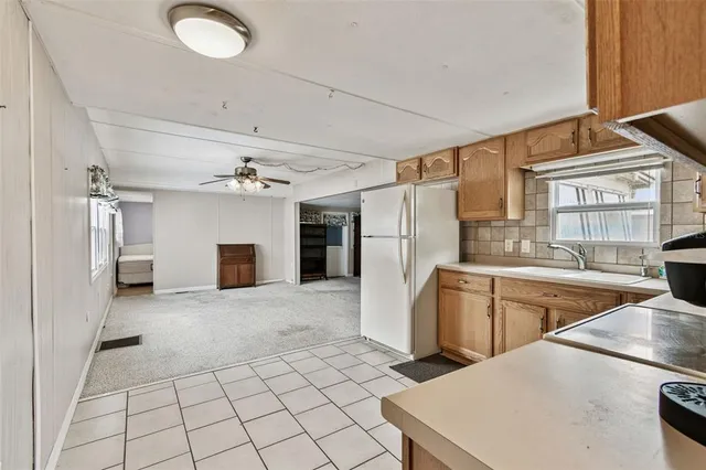 a kitchen with cabinets and a stove top oven