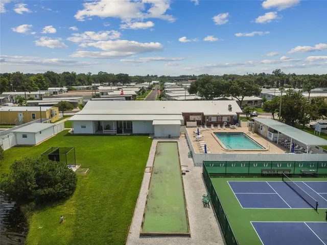 a view of a swimming pool with a lounge chairs