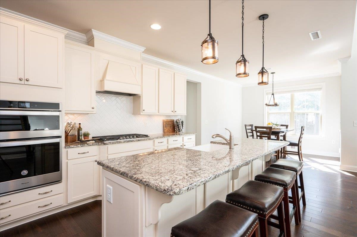 This gourmet kitchen offers so much counterspace with the island and plenty of surface cooking areas. Gourmet kitchen