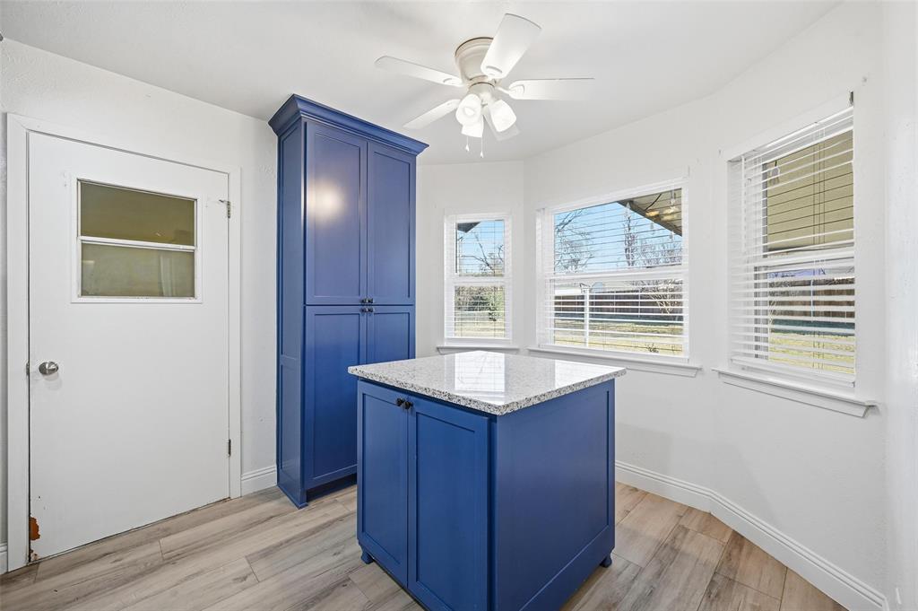 1164 Valley View Drive Hurst, TX 76053 - Photo 8 of 21 Kitchen cabinetry with island. Island can be moved to utilize this space as a breakfast nook. Island has great stroage.