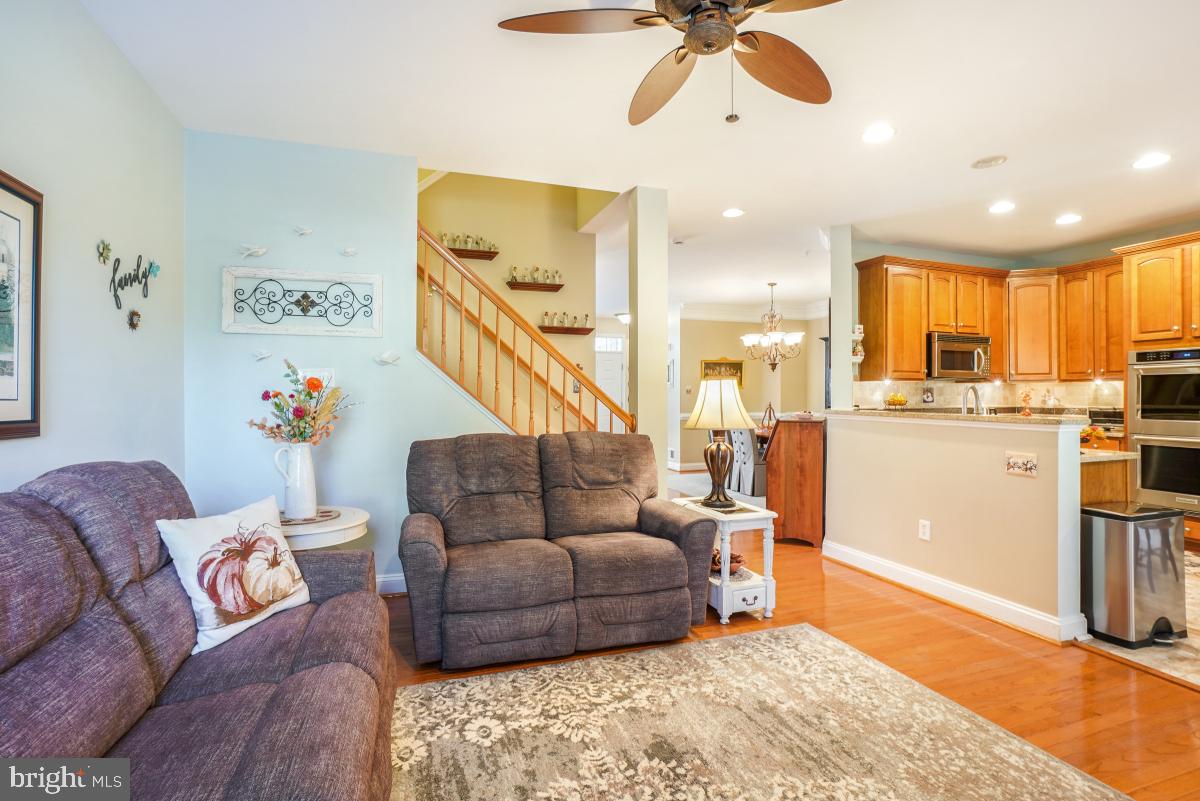 7606 Vulpe Court Odenton, MD 21113 - Photo 11 of 45 a living room with furniture and kitchen view