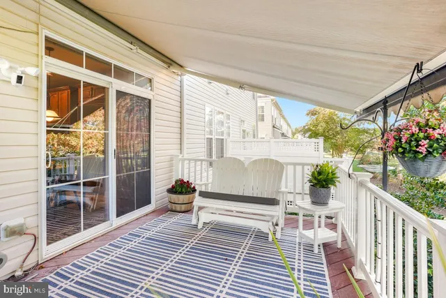 a view of outdoor space with deck and furniture