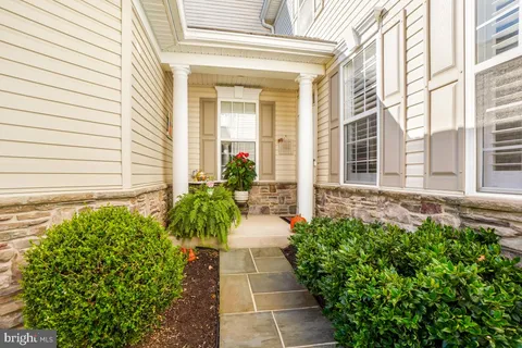 a entryway with flower pots