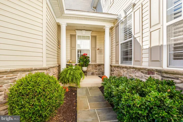 a entryway with flower pots