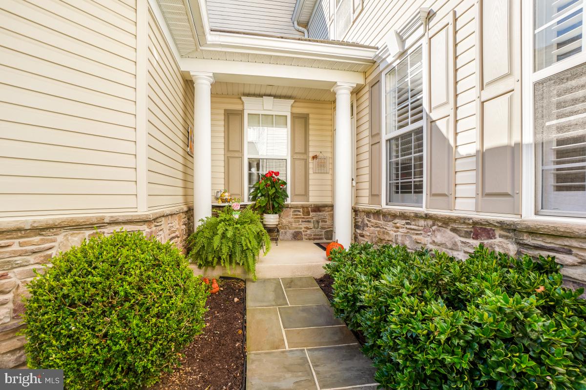 7606 Vulpe Court Odenton, MD 21113 - Photo 2 of 45 a entryway with flower pots