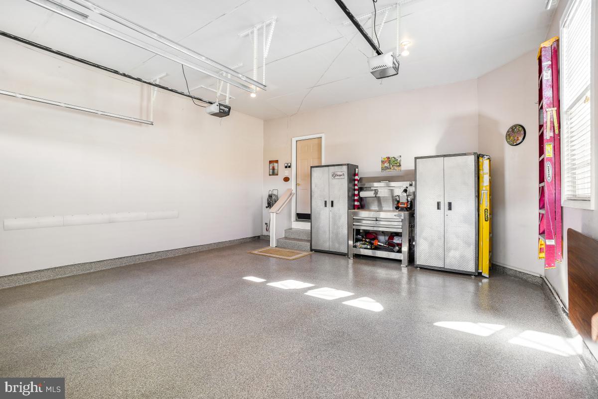 7606 Vulpe Court Odenton, MD 21113 - Photo 26 of 45 a view of a livingroom with furniture and a ceiling fan