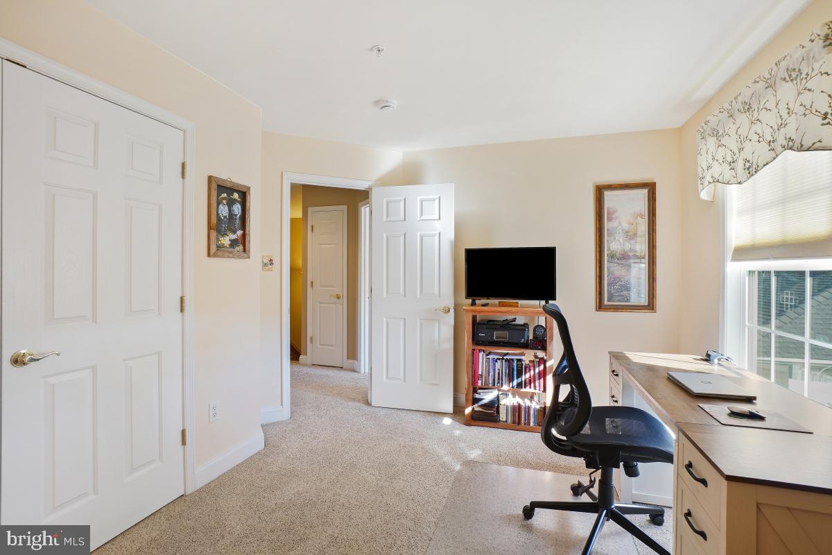 7606 Vulpe Court Odenton, MD 21113 - Photo 28 of 45 a view of a workspace with furniture and a window