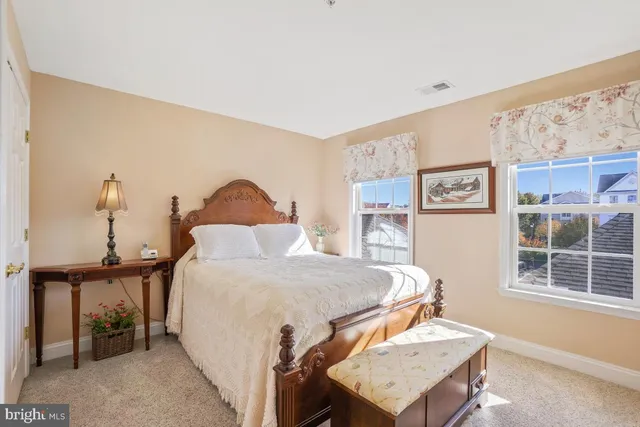 a large white bed in a white room