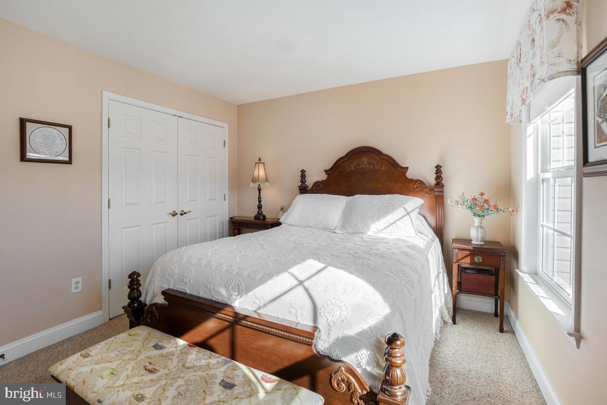 7606 Vulpe Court Odenton, MD 21113 - Photo 30 of 45 a bedroom with a bed and a window