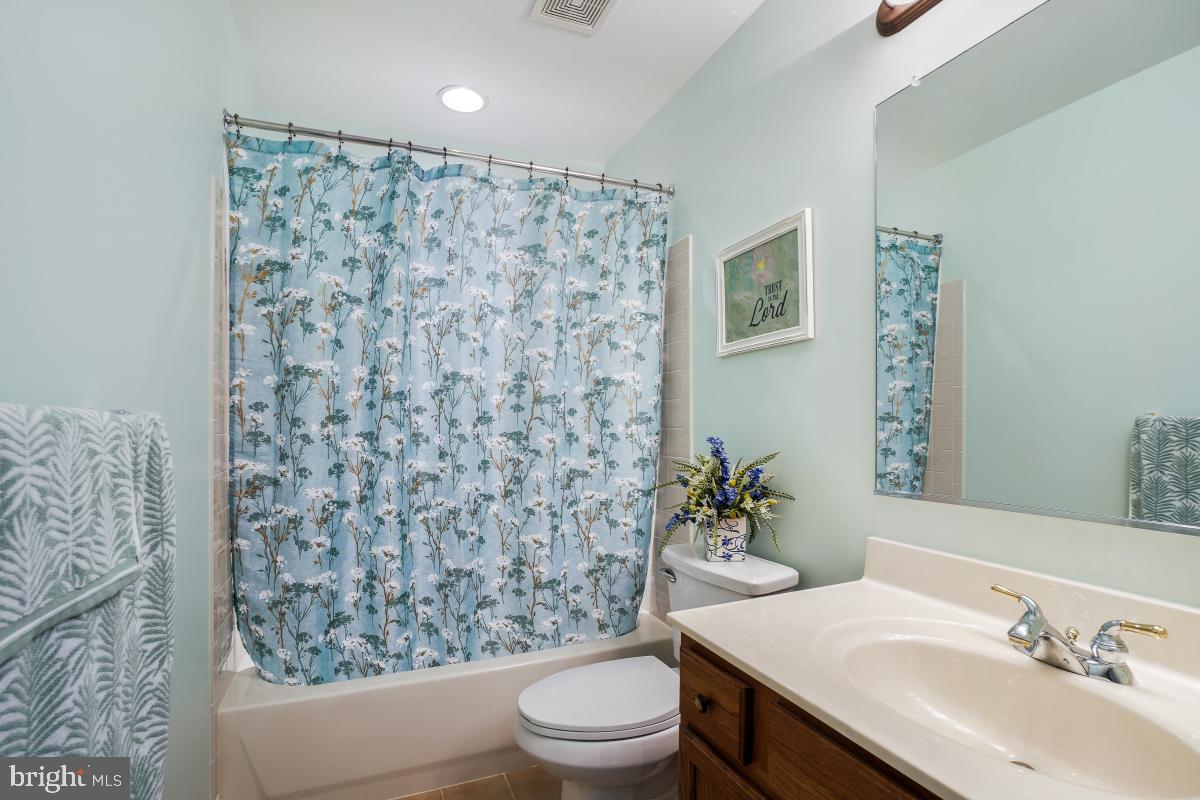 7606 Vulpe Court Odenton, MD 21113 - Photo 32 of 45 a bathroom with a sink toilet and a mirror