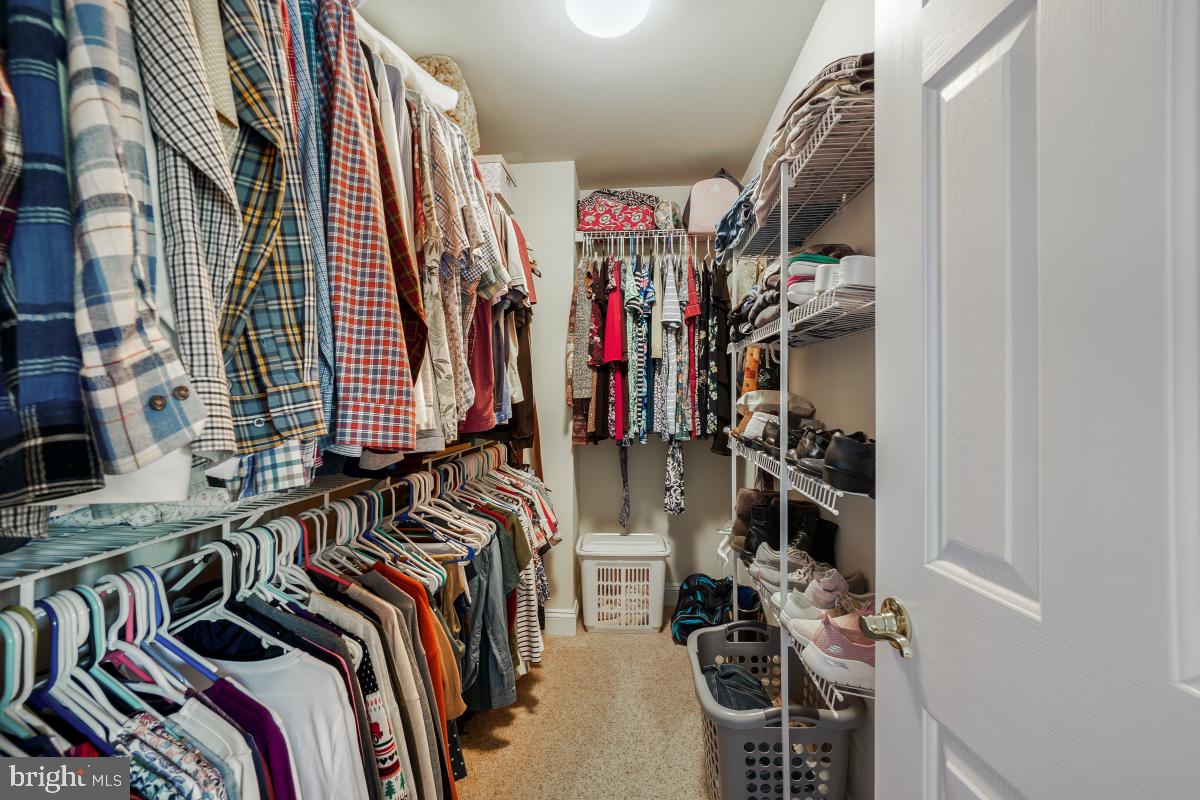 7606 Vulpe Court Odenton, MD 21113 - Photo 38 of 45 a view of walk in closet with clothes