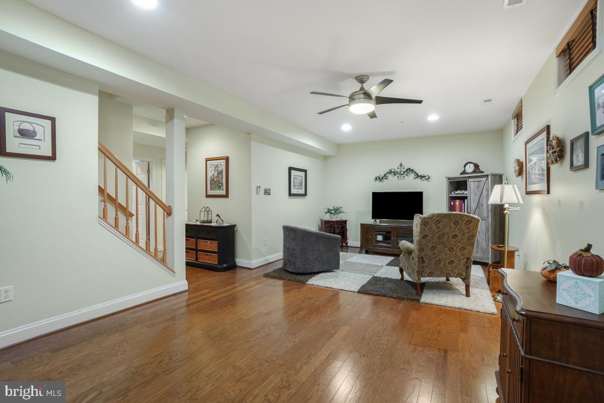 7606 Vulpe Court Odenton, MD 21113 - Photo 39 of 45 a living room with furniture and a flat screen tv