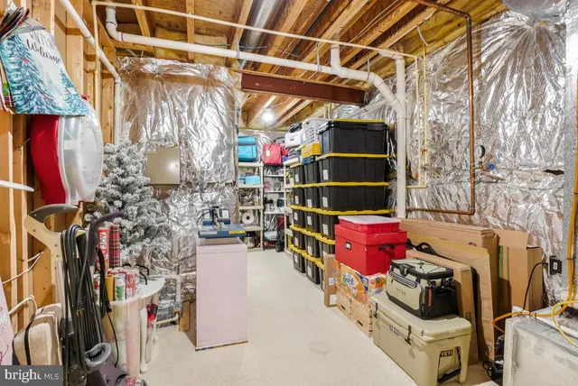 a view of a house with a small yard and wooden fence