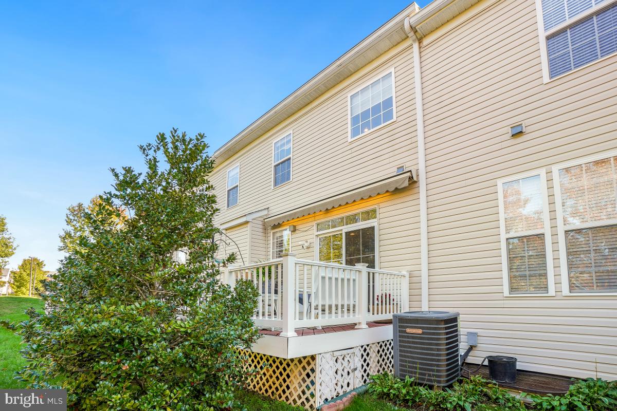 7606 Vulpe Court Odenton, MD 21113 - Photo 43 of 45 a front view of a house with a garden
