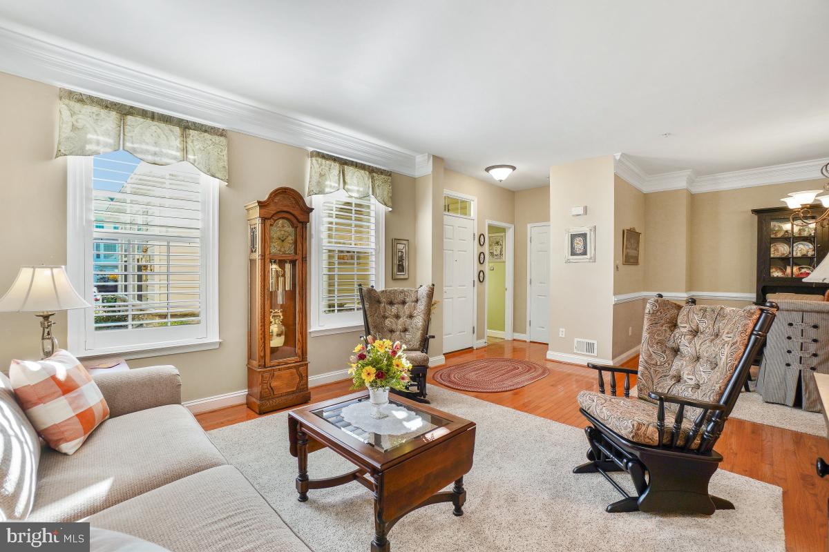 7606 Vulpe Court Odenton, MD 21113 - Photo 6 of 45 a living room with furniture and a large window