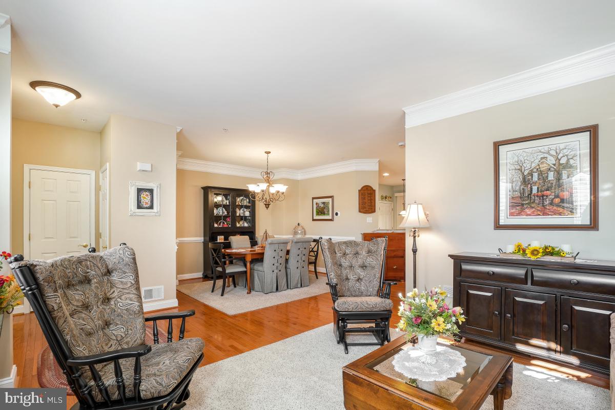 7606 Vulpe Court Odenton, MD 21113 - Photo 7 of 45 a living room with furniture and wooden floor