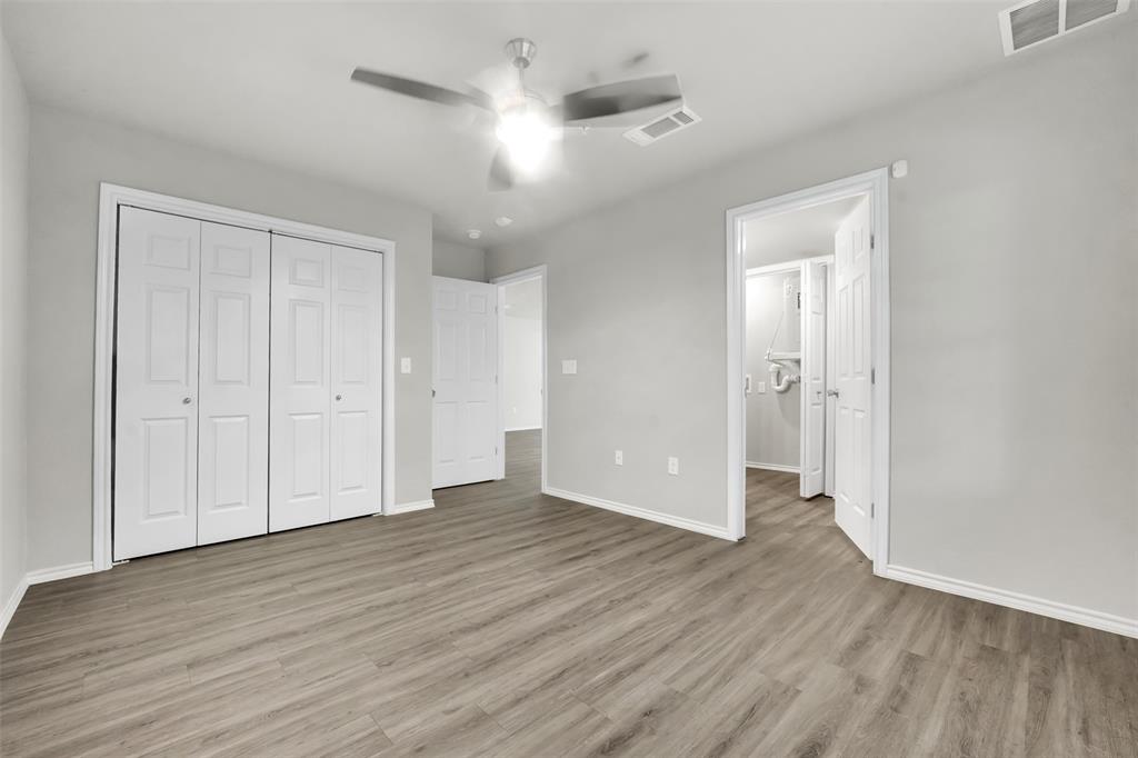 6108 Abrams Road, Unit 201 Dallas, TX 75231 - Photo 12 of 19 a view of an empty room with wooden floor