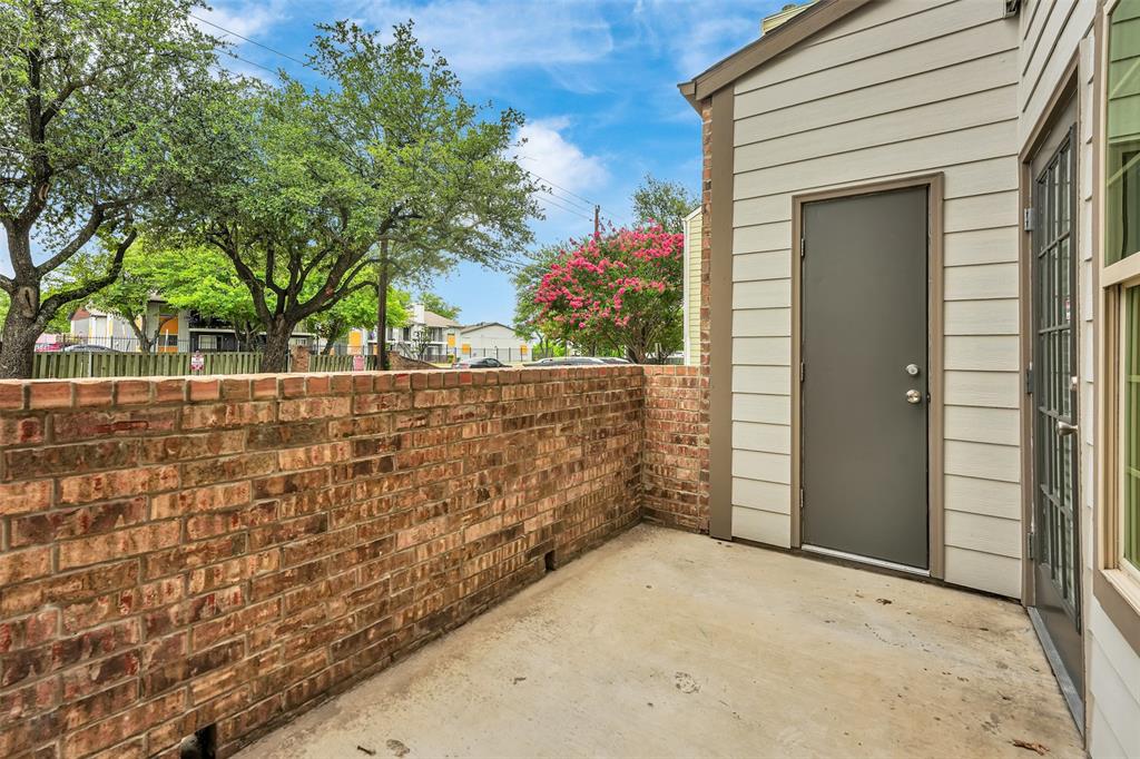 6108 Abrams Road, Unit 201 Dallas, TX 75231 - Photo 16 of 19 front view of a house with a trees