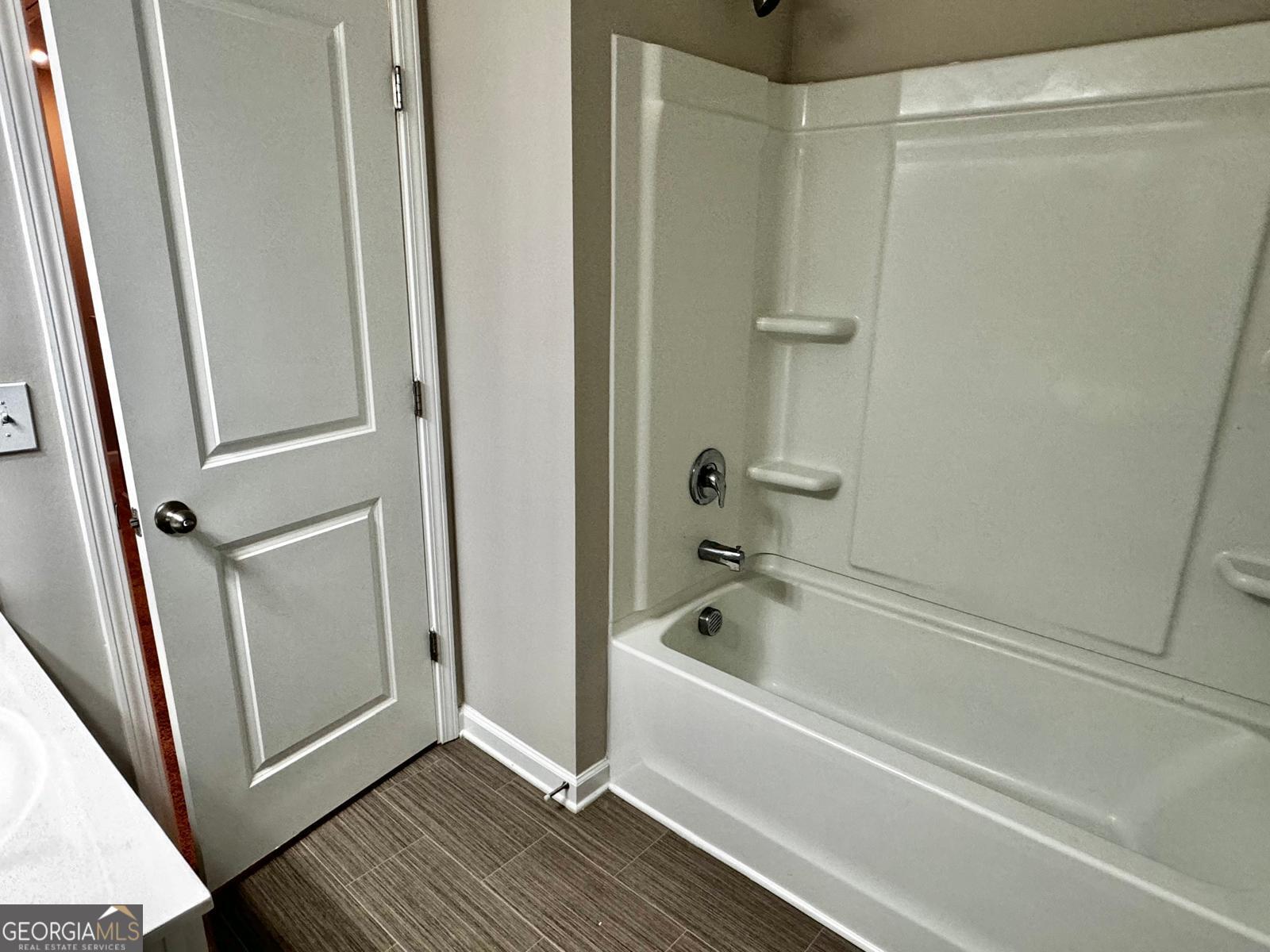 1397 Ben Park Way Grayson, GA 30017 - Photo 14 of 17 a white bath tub sitting next to a window