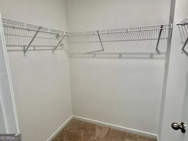 a view of a room with racks on the wall
