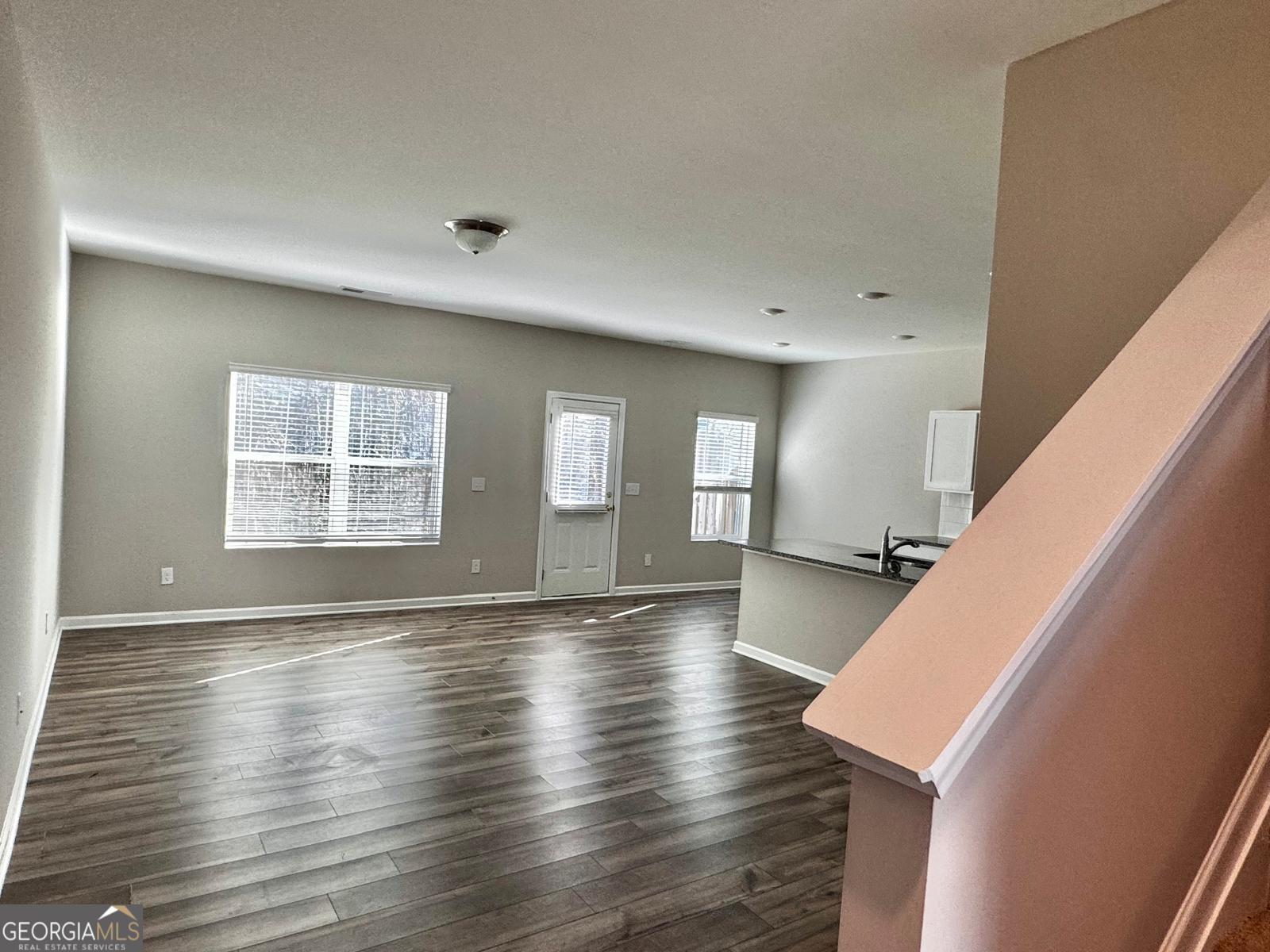 1397 Ben Park Way Grayson, GA 30017 - Photo 2 of 17 a view of an empty room with wooden floor and a window