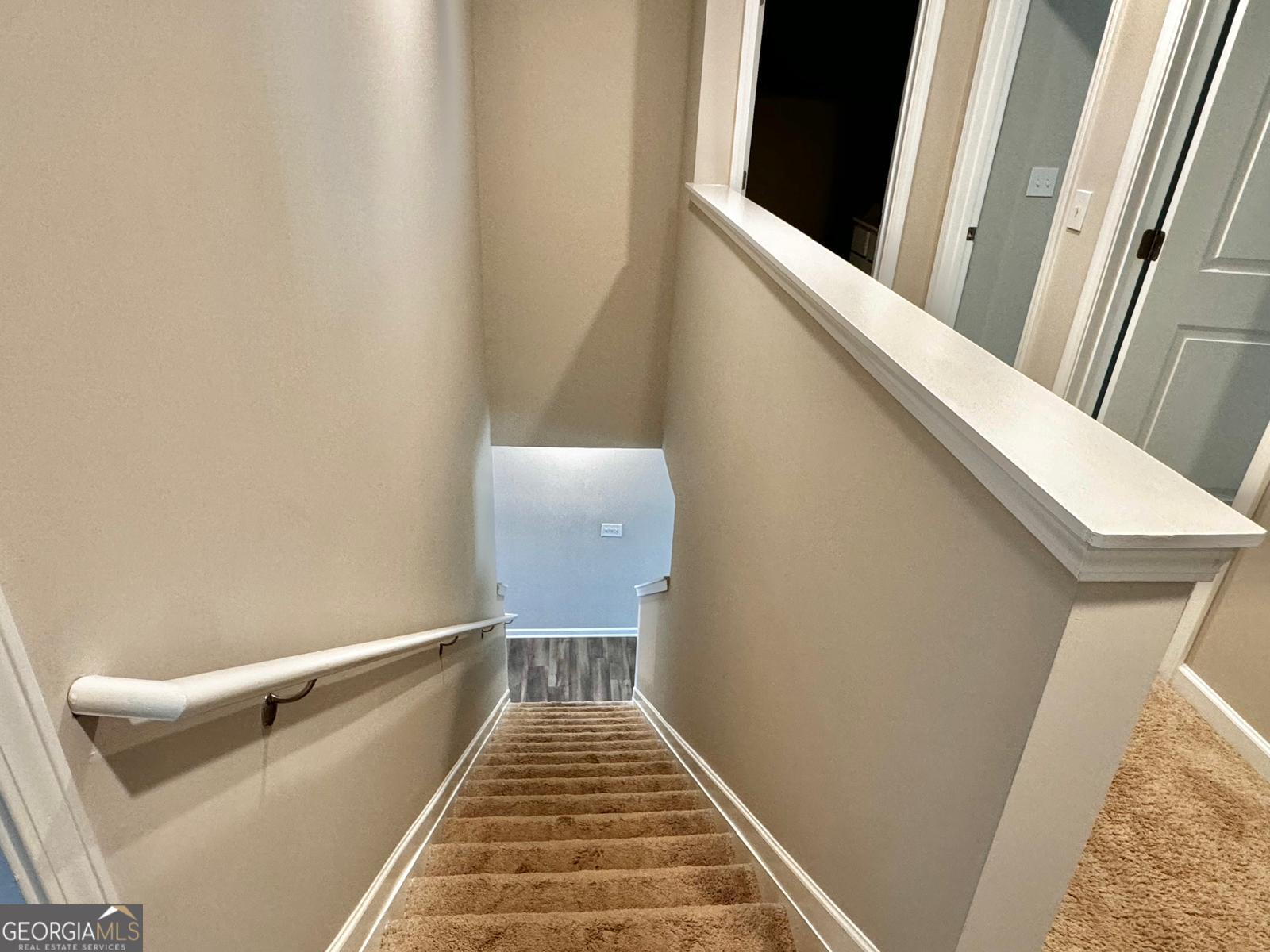 1397 Ben Park Way Grayson, GA 30017 - Photo 8 of 17 a view of a stairs and an empty room