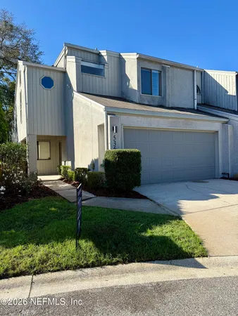 a kitchen with stainless steel appliances a stove a sink and a refrigerator