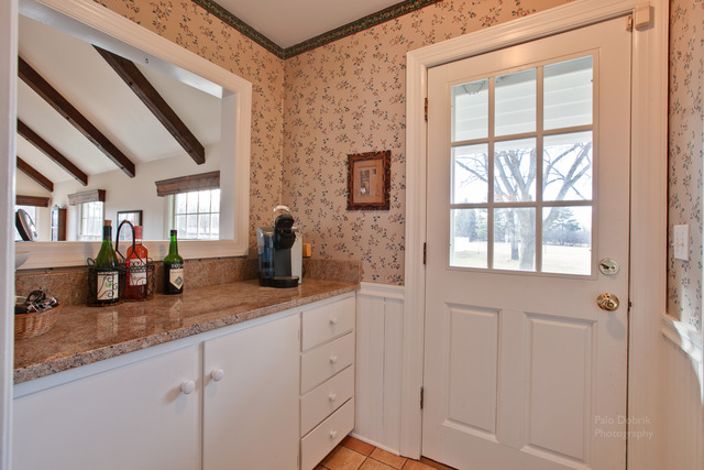 385 Old Sutton Road Barrington Hills, IL 60010 - Photo 12 of 25 a kitchen with sink and mirror