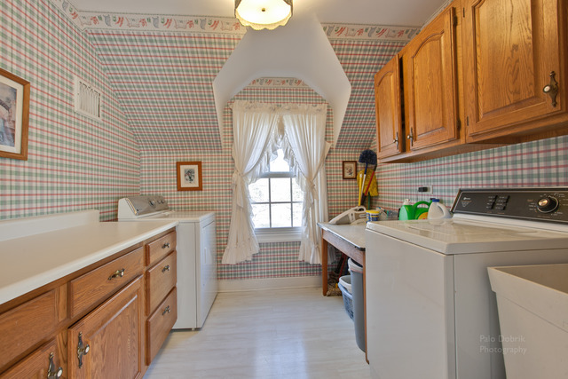 385 Old Sutton Road Barrington Hills, IL 60010 - Photo 20 of 25 a kitchen that has a sink and a stove