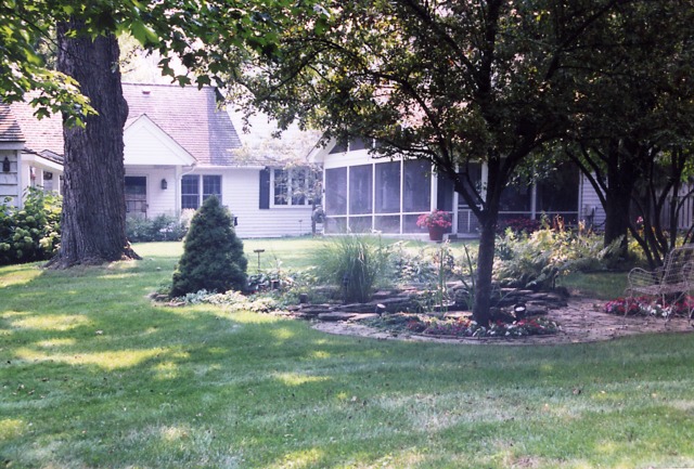 385 Old Sutton Road Barrington Hills, IL 60010 - Photo 23 of 25 a front view of a house with a garden