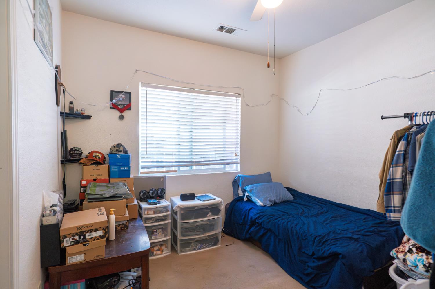 123 Manzanita Avenue Merced, CA 95341 - Photo 13 of 30 a bedroom with furniture and a window
