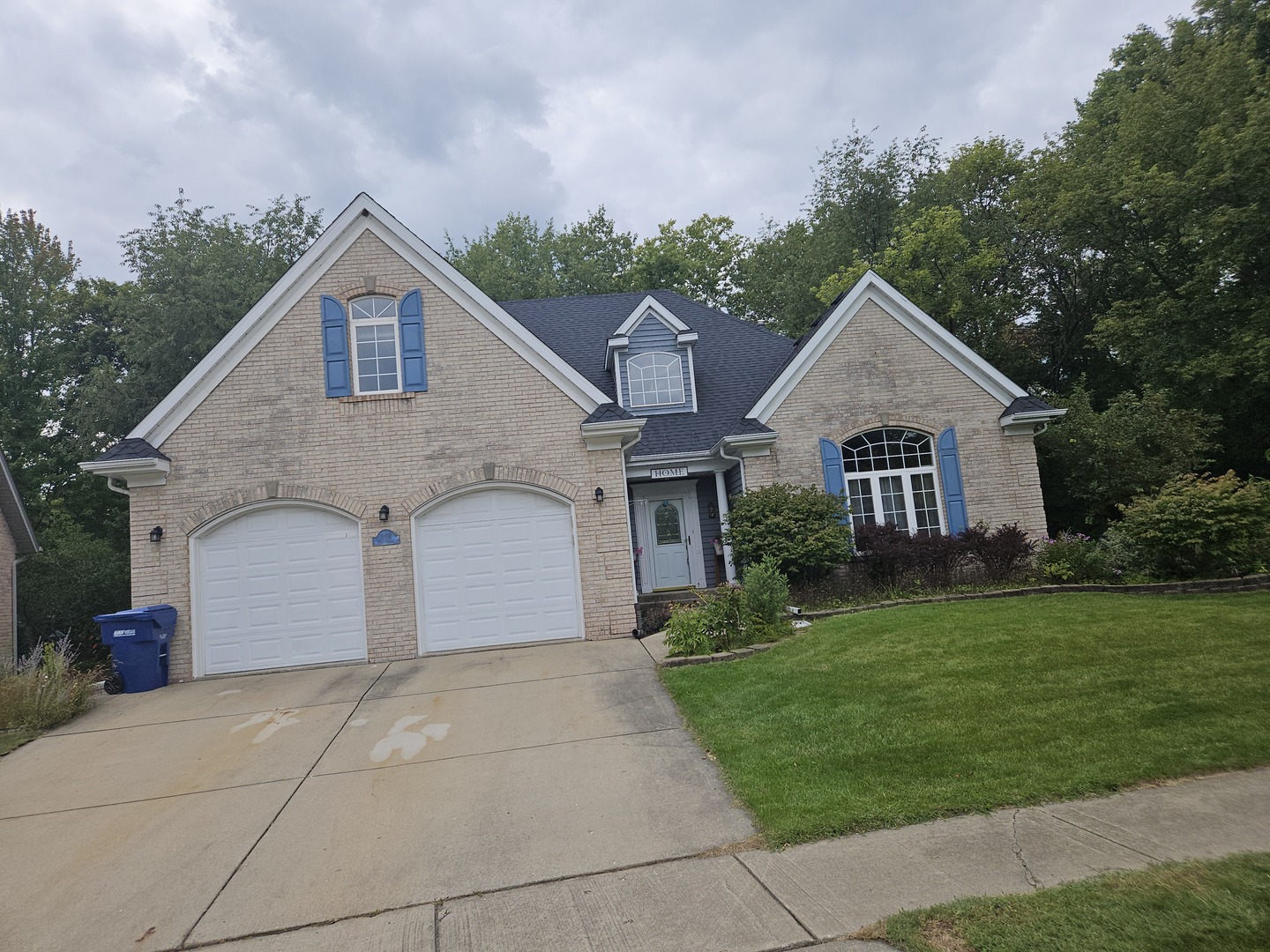 688 Fox Hollow Court DeKalb, IL 60115 - Photo 1 of 31 a view of a white house next to a yard with large trees