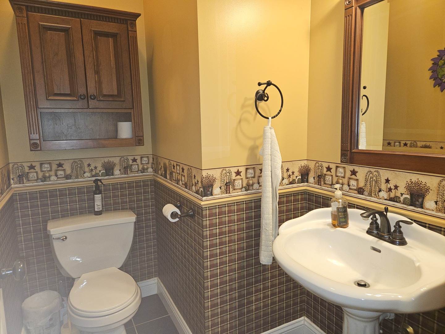 688 Fox Hollow Court DeKalb, IL 60115 - Photo 17 of 31 a bathroom with a sink a toilet and mirror