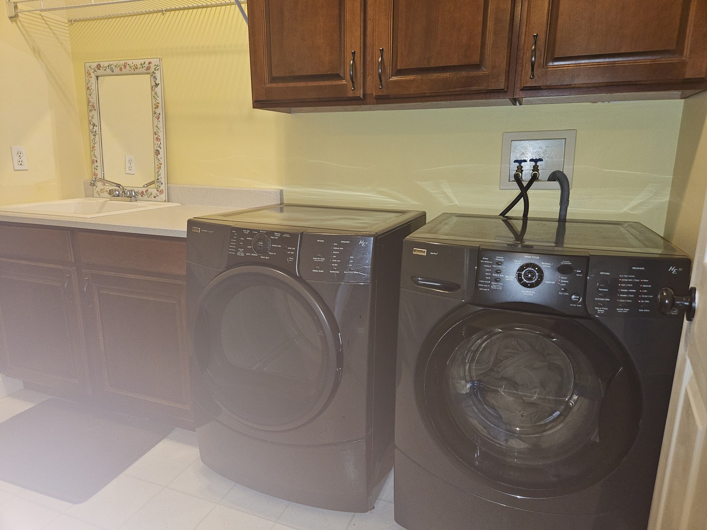 688 Fox Hollow Court DeKalb, IL 60115 - Photo 24 of 31 a utility room with sink dryer and washer