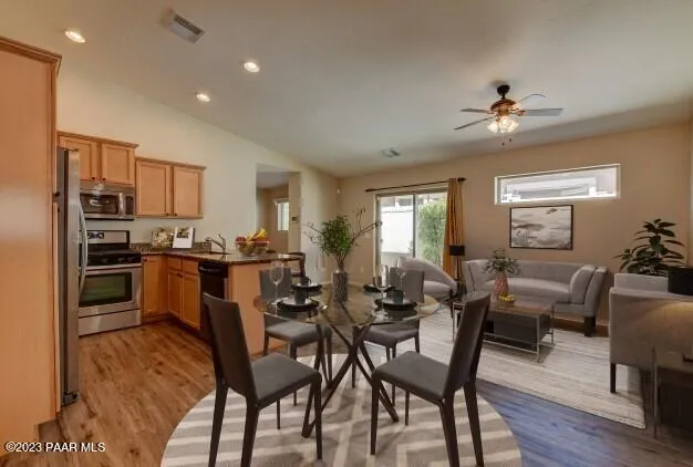 a view of a dining room with furniture window and wooden floor