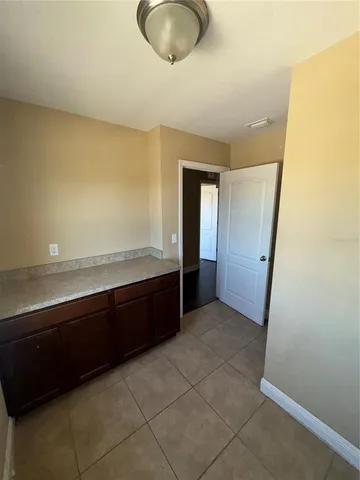 a view of a hallway and an empty room