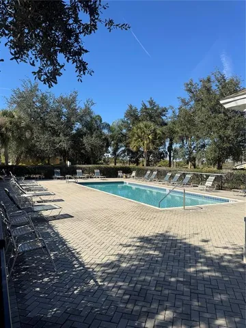 a view of swimming pool with a yard
