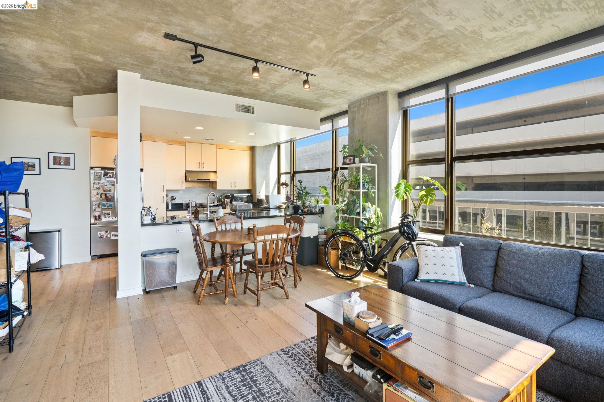 311 2nd Street, Unit 511 Oakland, CA 94607 - Photo 16 of 44 Living area featuring light wood-type flooring and rail lighting