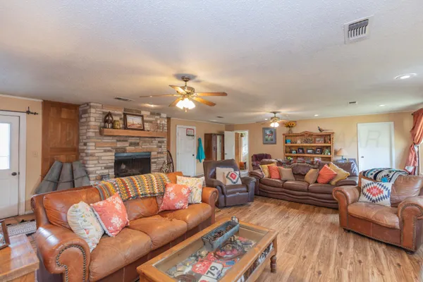 a bedroom with bed and wooden floor